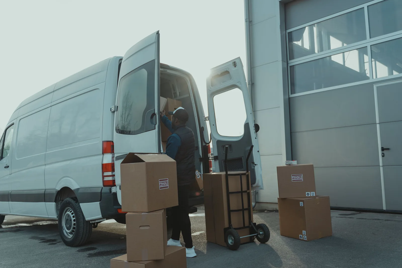 Courier van being loaded with parcels