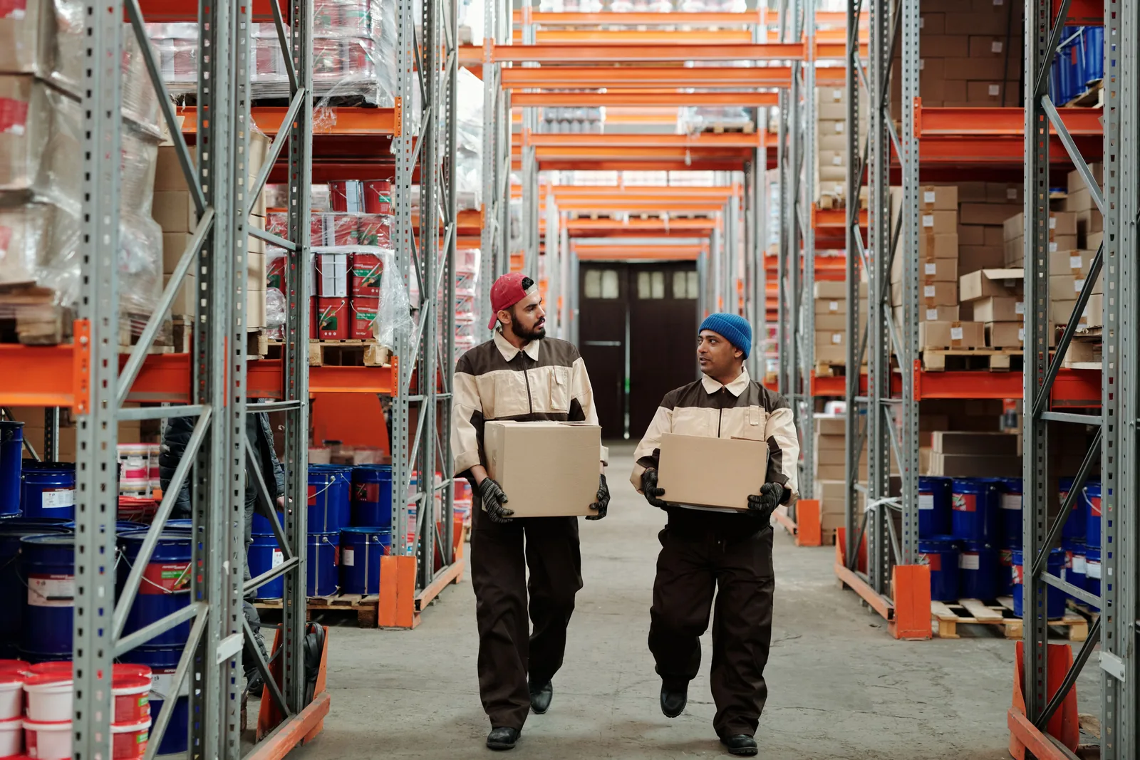 Warehouse team carrying parcels